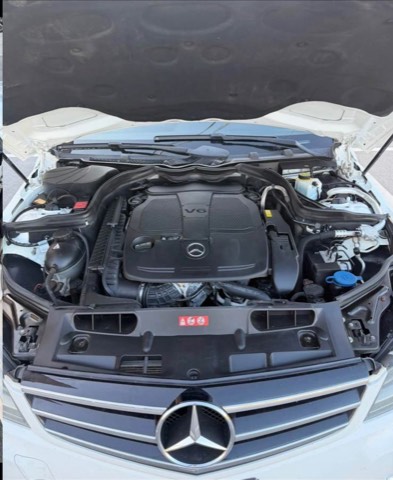 Engine bay of a previously sourced white Mercedes-Benz C300