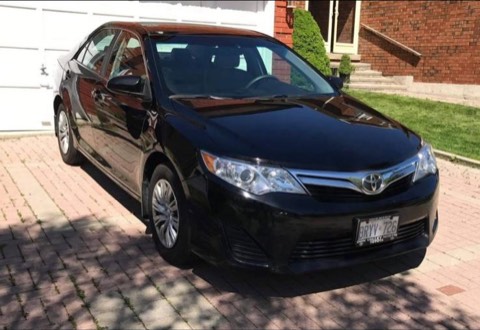 Black Toyota Camry LE — exterior — front right