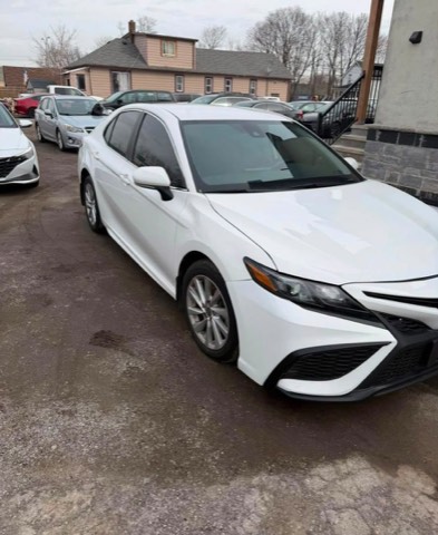White Toyota Camry on a dealership lot