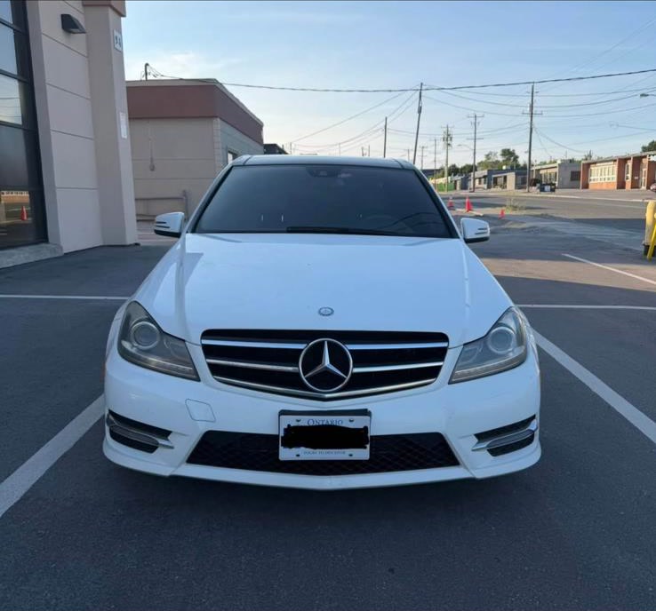 White Mercedes-Benz C300 previously sourced from Canada, front view