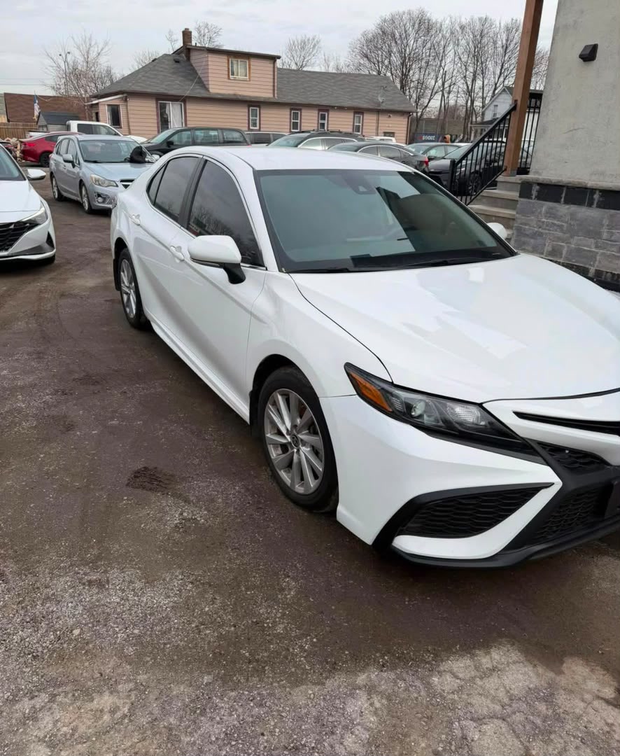 White Toyota Camry SE previously imported from Canada, front right view